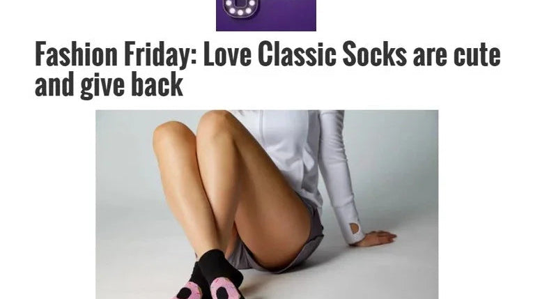 Woman wearing black and pink Love Classic socks, sitting on floor, stylish and cute fashion.