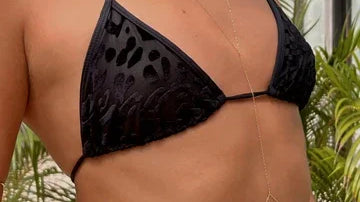 Woman wearing black animal print bikini top and gold body chain, Love Classic swimwear style