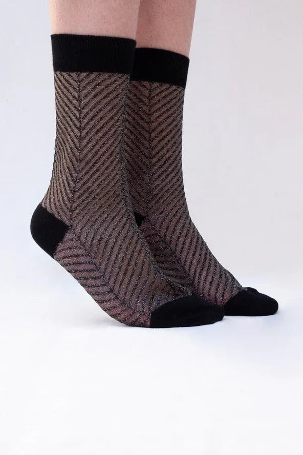 Sheer black socks with chevron pattern and solid black cuffs, toes, and heels from Love Classic