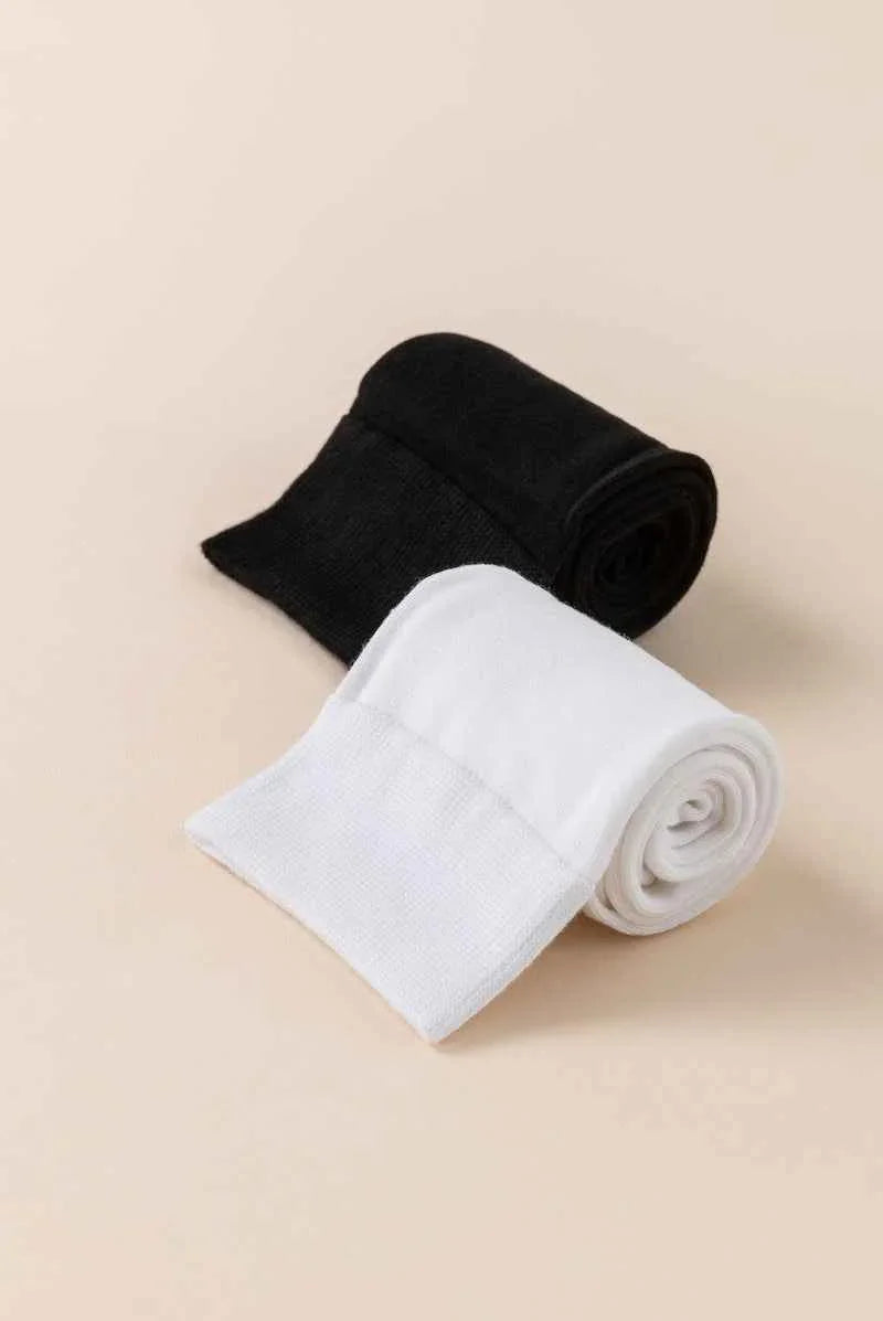 Love Classic black and white rolled socks on beige background, high quality styles