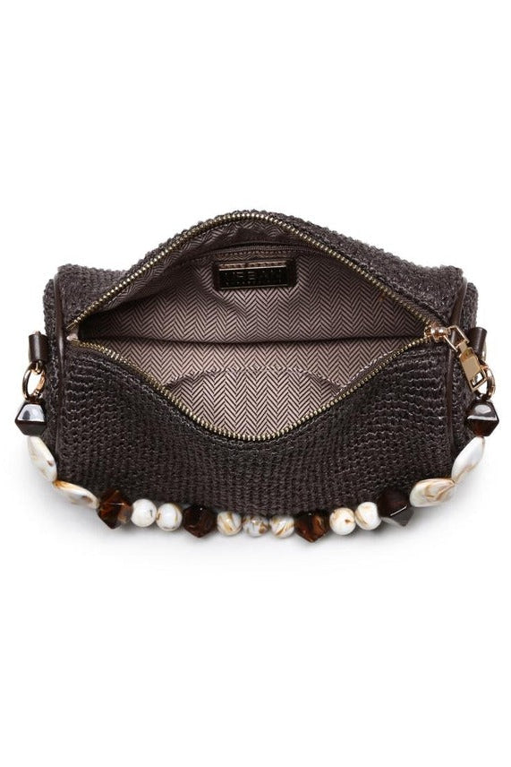 Interior of the chocolate Rachel Straw Clutch showing compact storage space designed to fit phone, cards, and small essentials.