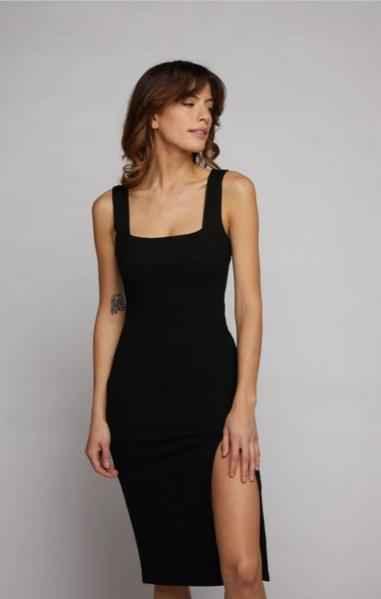 Woman wearing a sleeveless black dress with side slit, Love Classic fashion style