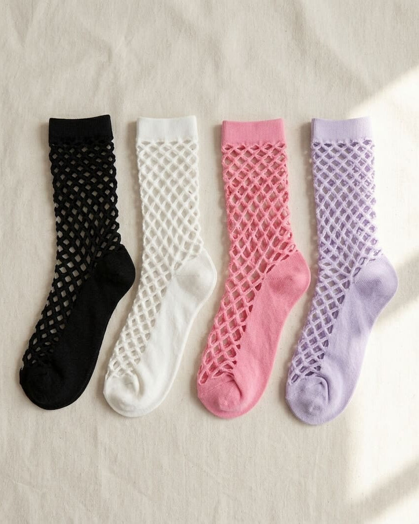 Bundled Pack, Midnight Lattice Fishnet Socks featuring breathable fishnet knit construction with flexible stretch support and assorted color variations in black, white, pink, and lavender, displayed on a soft fabric background to highlight versatile styling options and lightweight comfort.