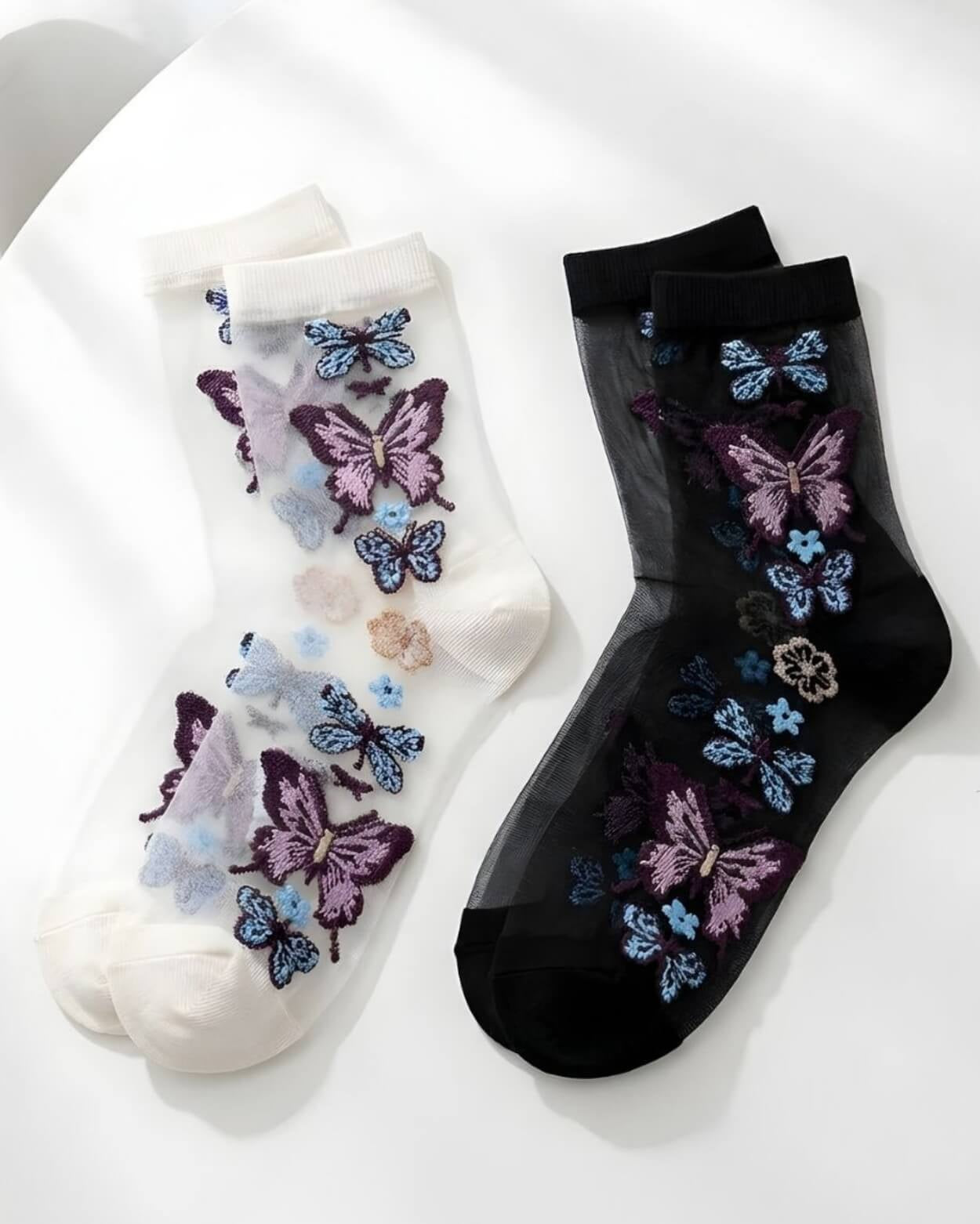 Butterfly Sheer Socks 2-Pack featuring two color options in sheer mesh fabric with detailed butterfly embroidery, displayed flat on a clean white surface.