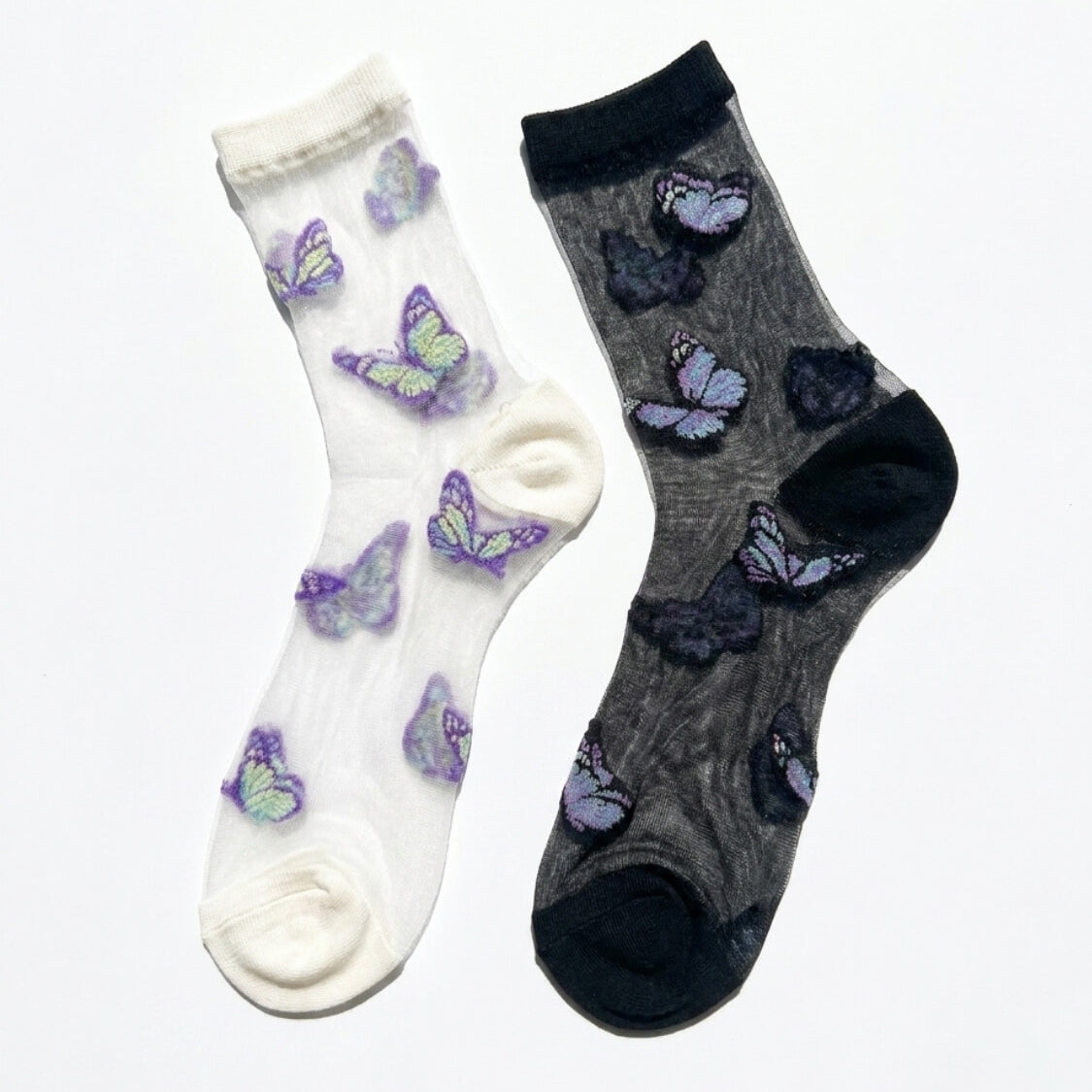 Butterfly Dreams Sheer Socks Bundle Pack featuring two sheer ankle socks with embroidered butterfly motifs, contrasting cuff and toe panels, displayed flat on a clean studio background, highlighting the light translucent finish and playful butterfly pattern.