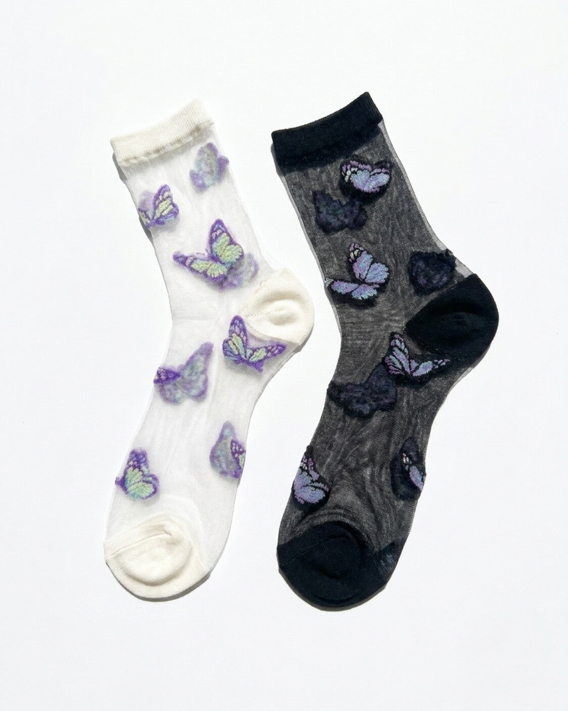 Butterfly Dreams Sheer Socks Bundle Pack featuring two sheer ankle socks with embroidered butterfly motifs, contrasting cuff and toe panels, displayed flat on a clean studio background, highlighting the light translucent finish and playful butterfly pattern.