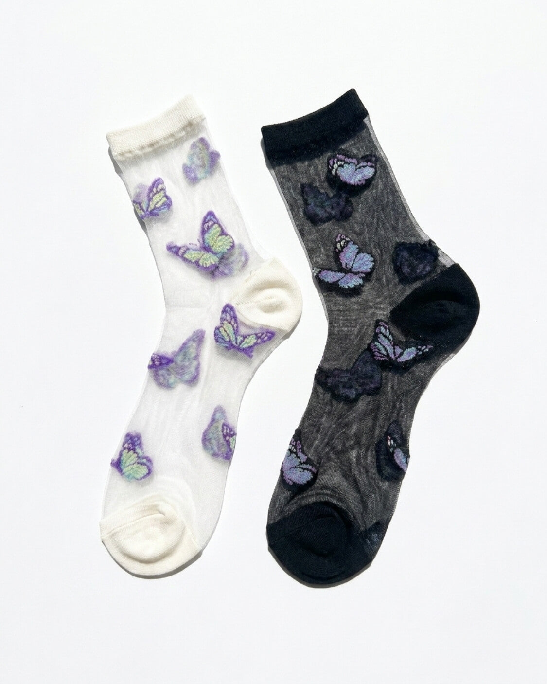 Butterfly Dreams Sheer Socks Bundle Pack featuring two sheer ankle socks with embroidered butterfly motifs, contrasting cuff and toe panels, displayed flat on a clean studio background, highlighting the light translucent finish and playful butterfly pattern.