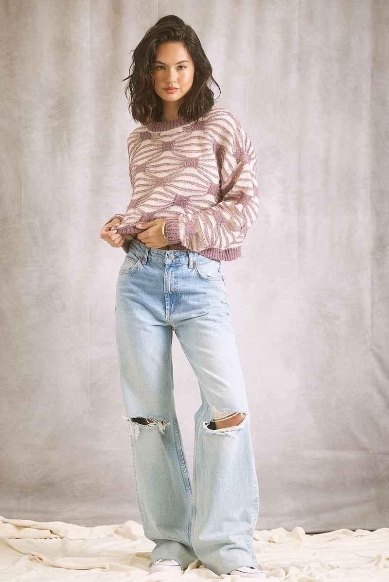 Woman in a patterned sweater and ripped jeans, Love Classic high quality fashion style