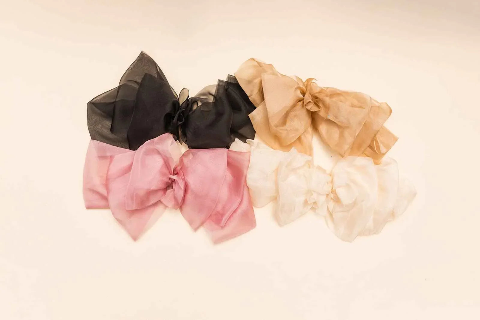 Love Classic sheer hair bows in black, pink, beige, and white on neutral background