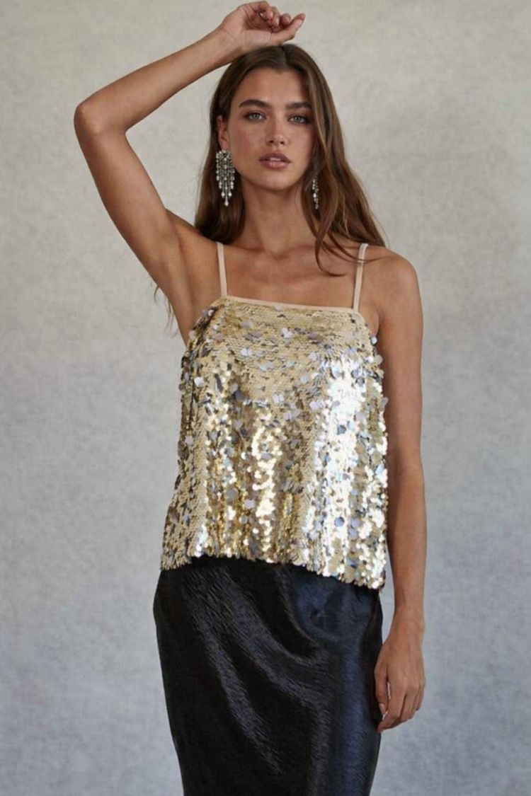 Can't Control Sequin Top, gold sequin camisole with a relaxed silhouette and slim straps, styled with a black satin skirt to showcase the bold sparkle and party-ready look.