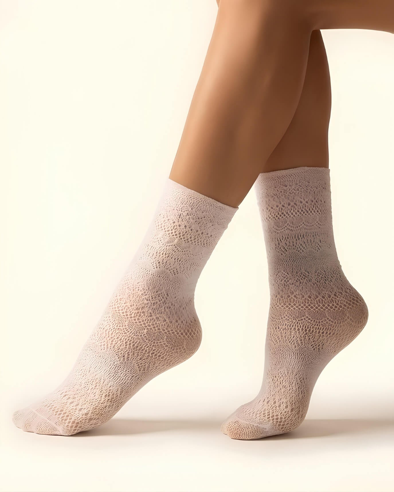Lace Pattern Sheer Sock featuring sheer white lace pattern socks paired with casual sneakers on a soft ottoman, highlighting versatile styling, lightweight structure, and refined textured finish.