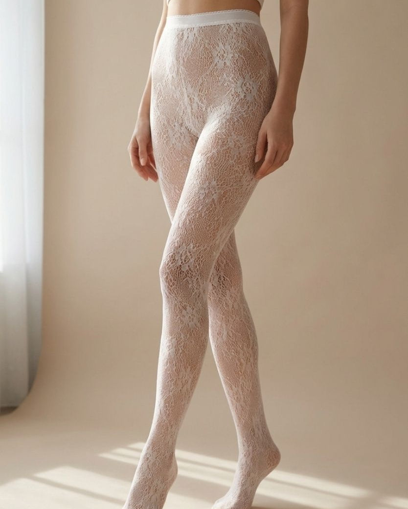 Sheer Floral Lace Tights featuring a delicate floral pattern and high waist fit, styled in a softly lit indoor setting near a window, highlighting the smooth stretch and elegant leg coverage.