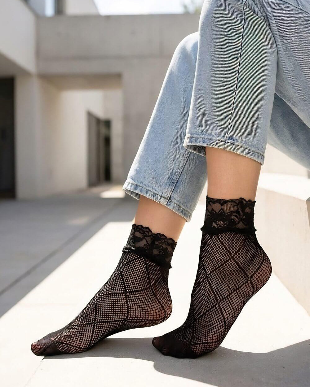 Diamond Lace Fishnet Socks featuring a lightweight mesh construction with geometric diamond accents and scalloped lace trim, worn with cuffed denim in a modern outdoor setting with soft natural lighting that highlights the intricate texture and feminine finish.
