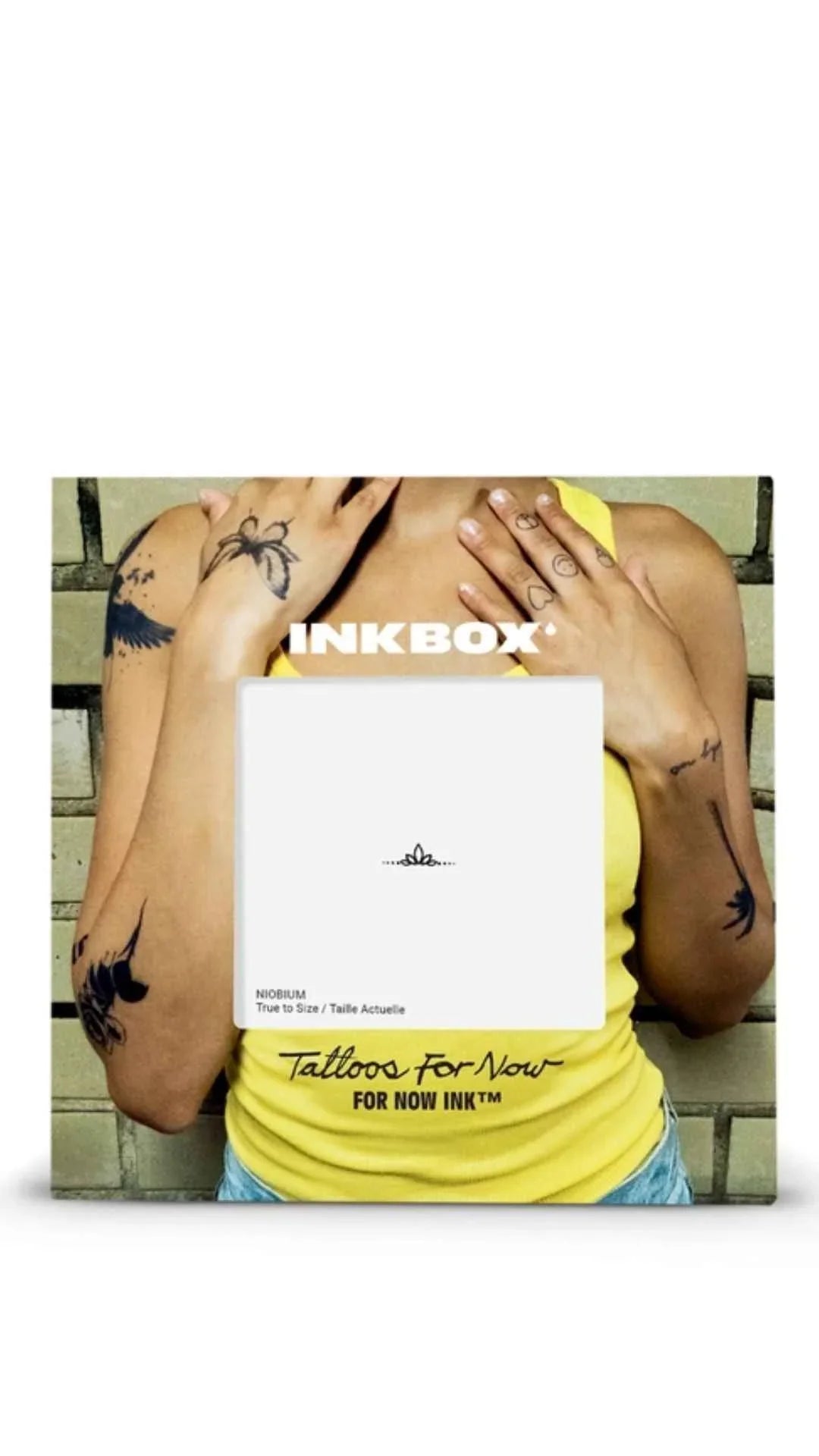 Person in yellow tank top with various temporary tattoos, showcasing Inkbox tattoo styles