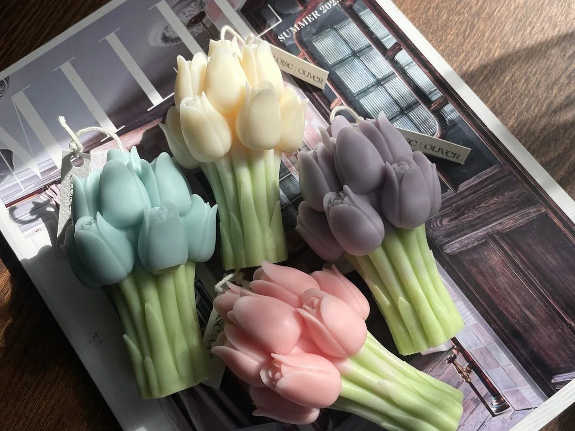 Colorful tulip-shaped candles from Love Classic displayed on a magazine under sunlight