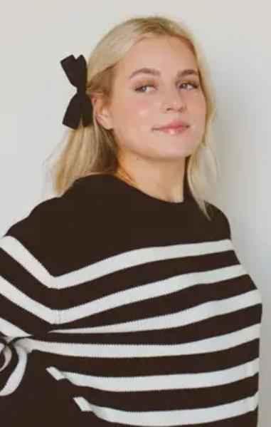 Woman in black and white striped sweater with black hair bow, Love Classic fashion style