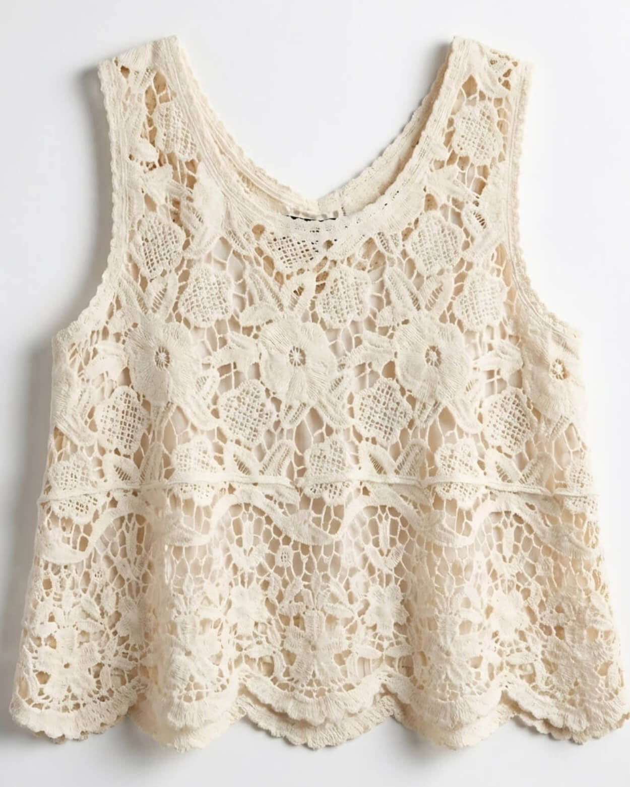 Crochet Lace Tank Top featuring a cream floral crochet lace design with intricate openwork pattern and scalloped hem, shown laid flat against a neutral background, product-only view.