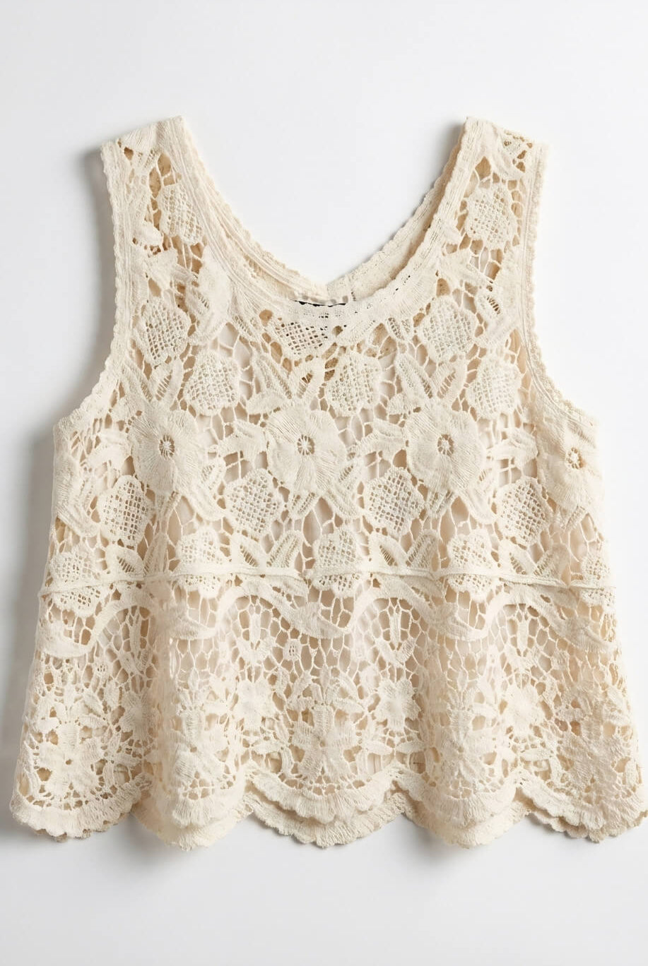 Crochet Lace Tank Top featuring a cream floral crochet lace design with intricate openwork pattern and scalloped hem, shown laid flat against a neutral background, product-only view.