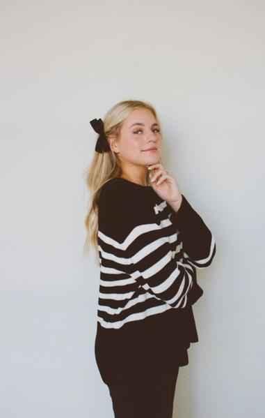 Woman in black and white striped sweater with black hair bow, Love Classic fashion style
