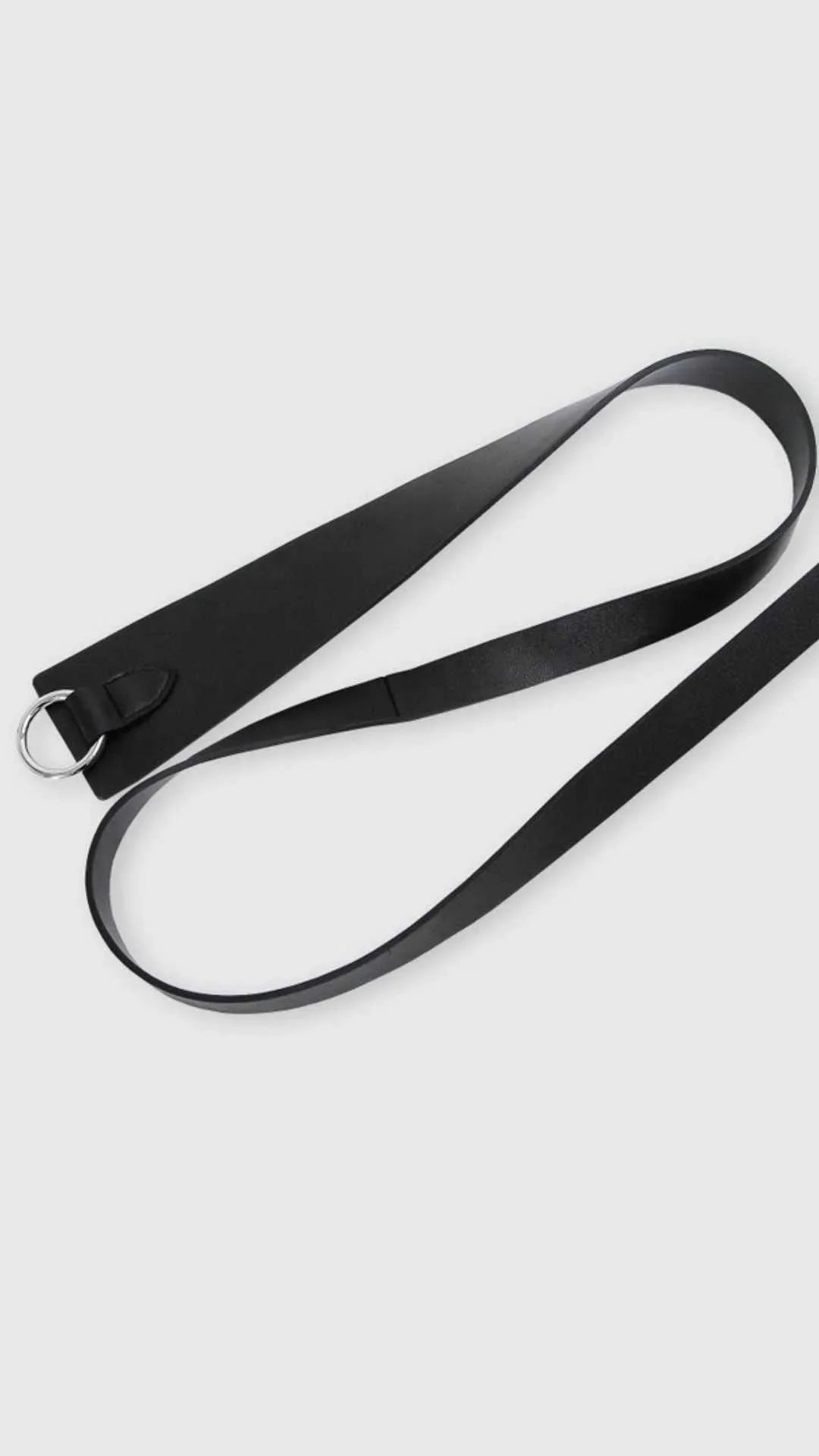Black leather fashion belt with silver D-ring buckle on white background, Love Classic style