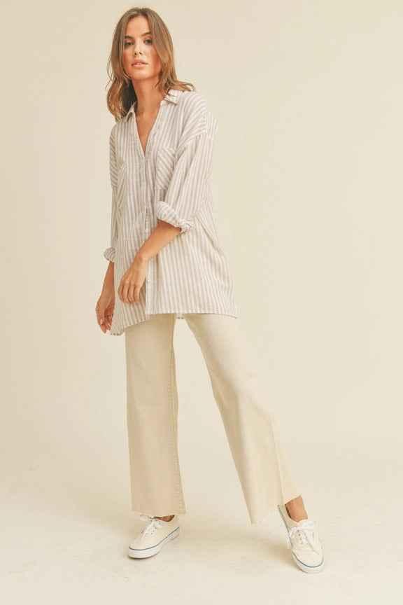 Woman in beige wide-leg pants and striped button-up shirt, Love Classic fashion style