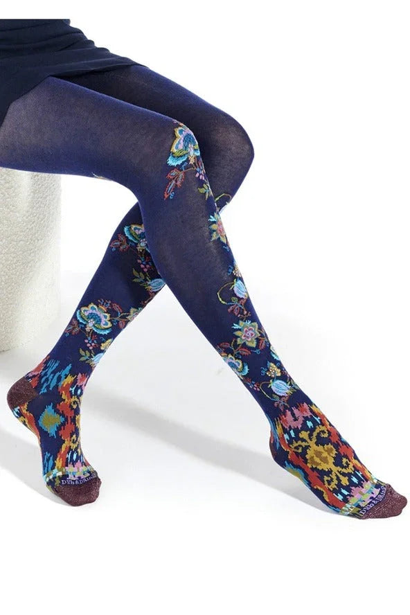 Woman wearing navy blue floral patterned tights, stylish hosiery from Love Classic