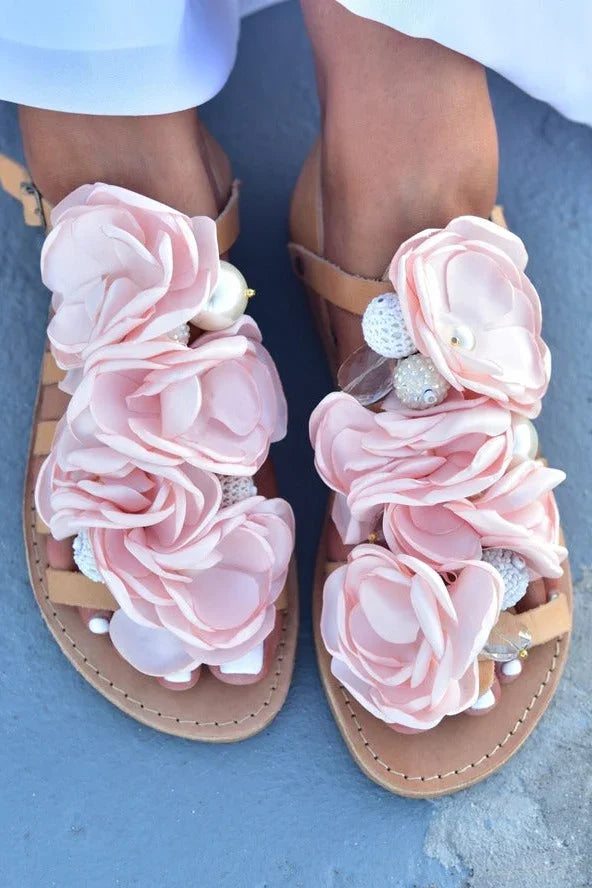 Tan sandals with large pink fabric flowers and pearl accents, Love Classic style