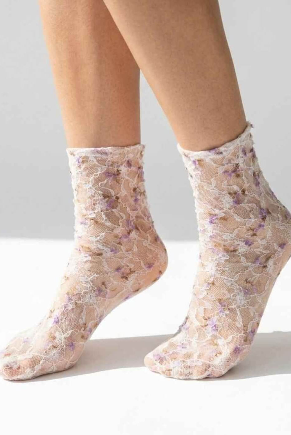 Floral Mesh Sheer Socks in purple floral lace mesh, worn on both feet to show the sheer texture and delicate pattern.