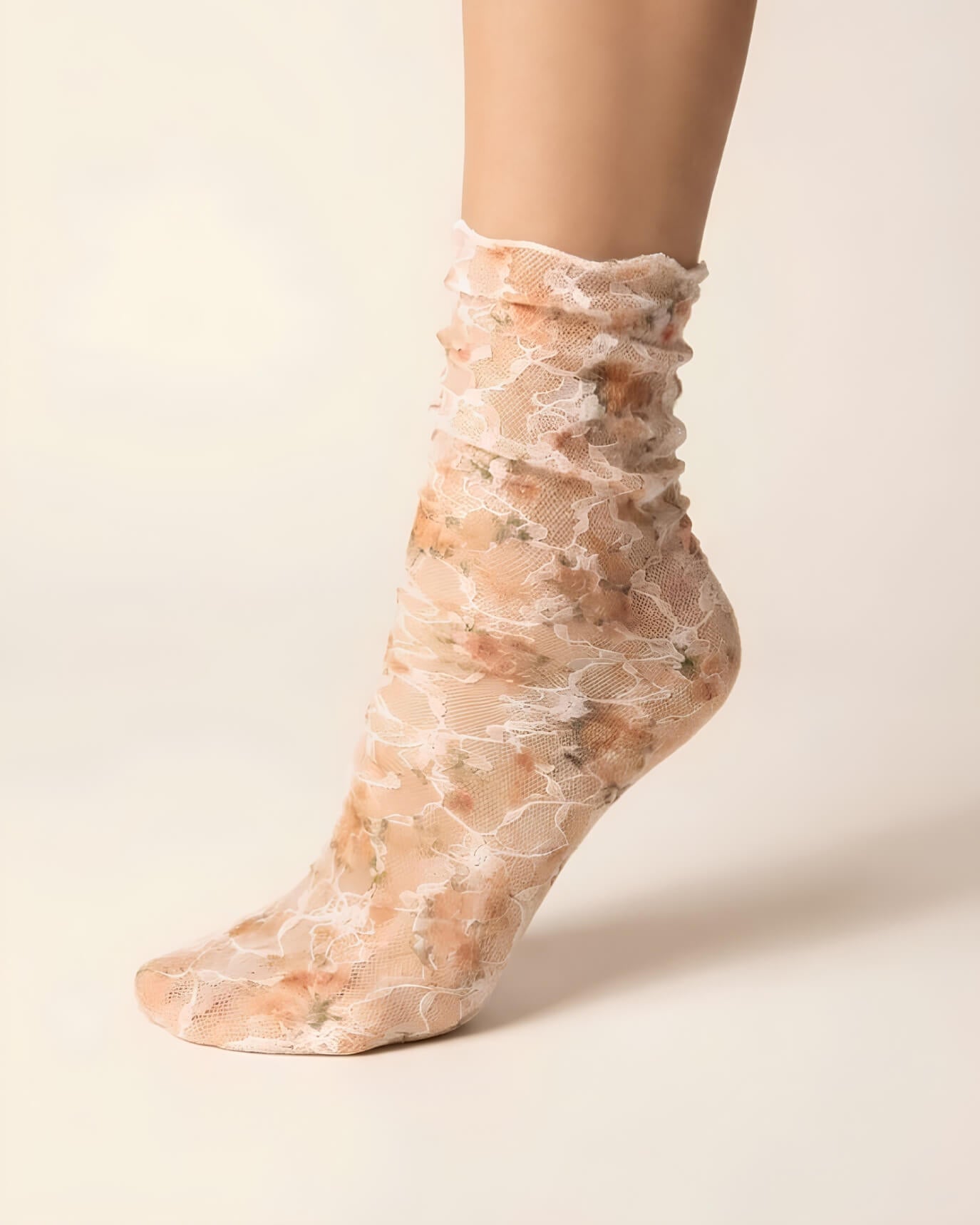 Floral Mesh Sheer Socks featuring transparent stretch mesh with delicate orange floral lace patterns and a softly gathered ankle fit, displayed in a close-up studio setting to highlight the lightweight texture, breathable comfort, and elegant vintage-inspired styling.