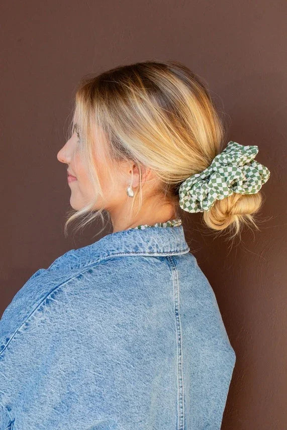 Model styled with the Lindsey Checked Jumbo Scrunchie showcasing the textured checkered fabric and oversized design gentle on hair.