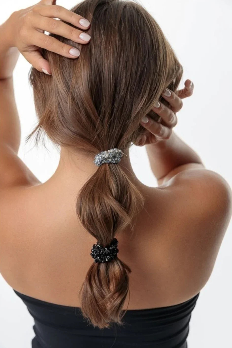 Woman with brown hair in a bubble ponytail, wearing beaded hair ties, Love Classic style