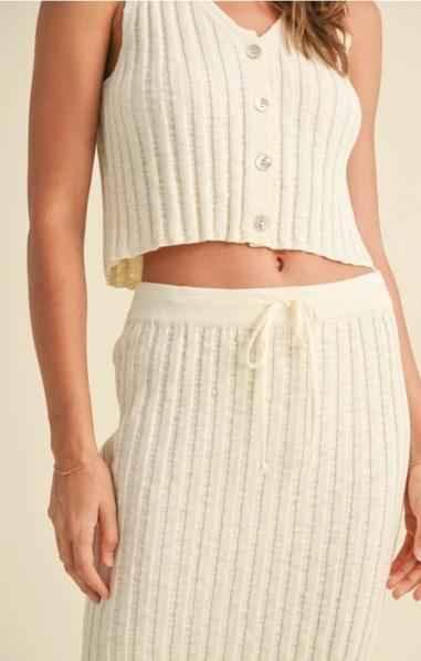 Woman wearing cream ribbed knit button crop top and skirt set, Love Classic cozy loungewear style