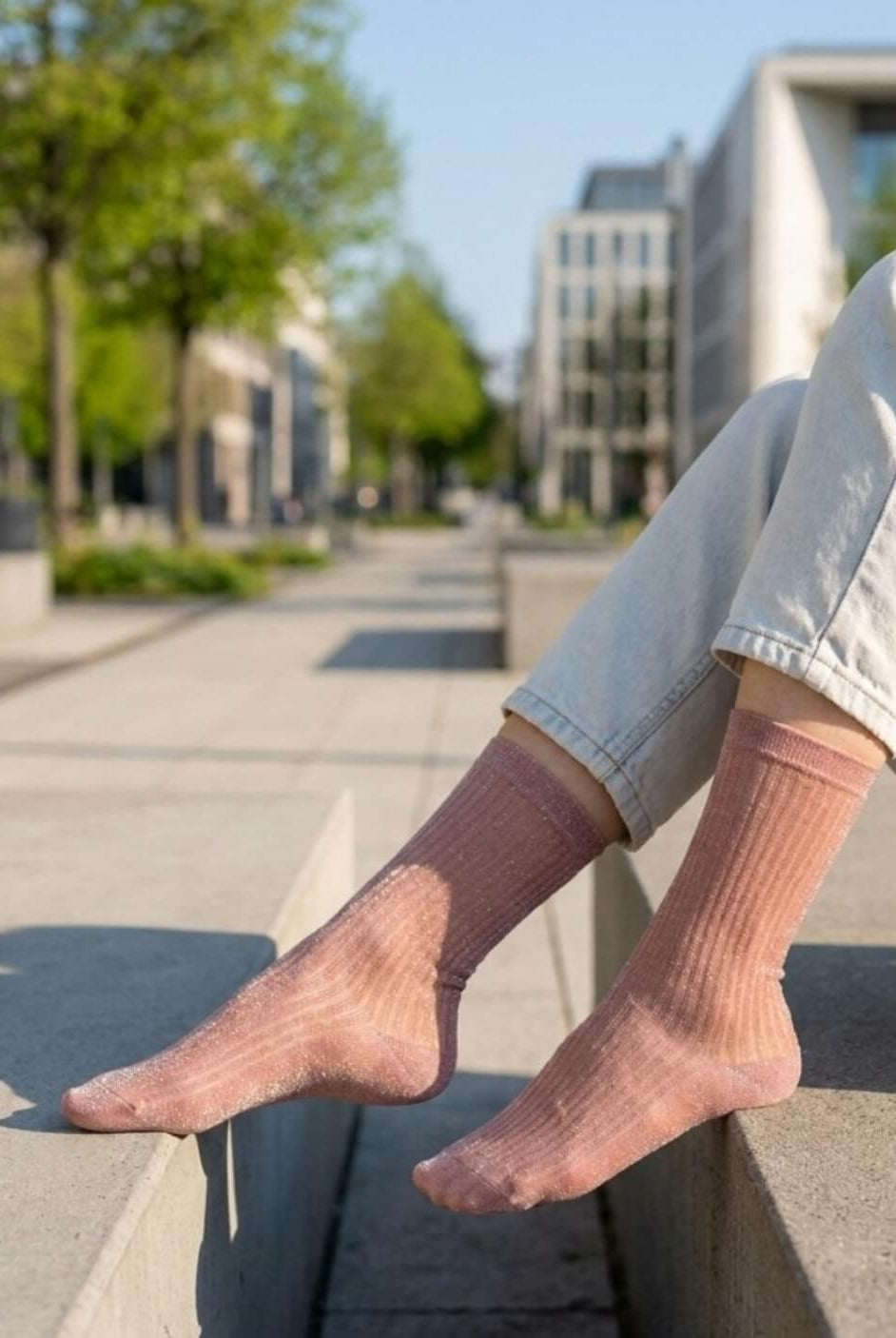 Sheer Metallic Ribbed Crew Socks in dusty pink with metallic sparkle, styled with light denim on an outdoor bench, emphasizing the breathable sheer texture and subtle ribbed pattern.
