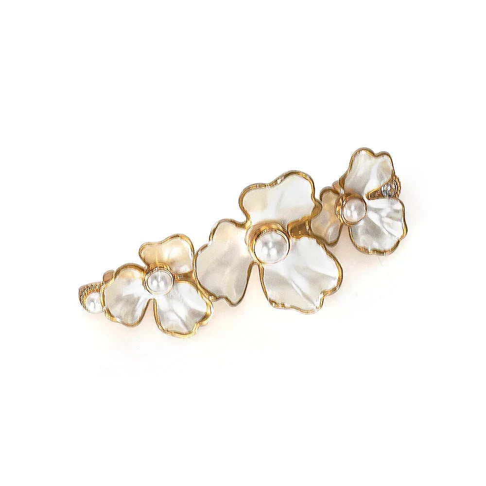 Gold floral hair clip with white petals and pearl centers by Love Classic
