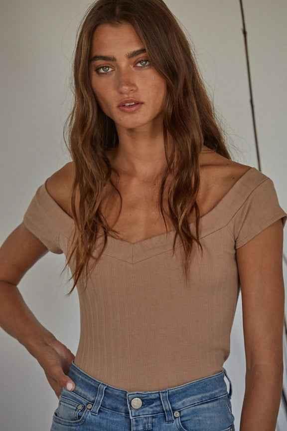 Woman in beige off-shoulder top and blue jeans, Love Classic high quality fashion style