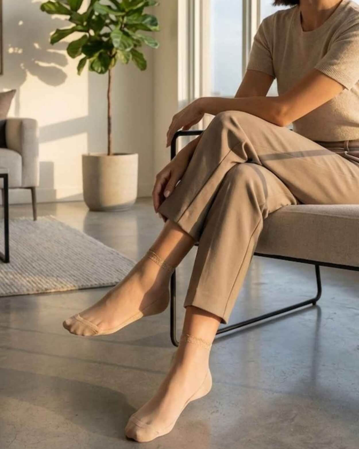 6-Pack Glitter Rim Sheer Crew Socks featuring nude-toned transparent mesh with subtle glitter ankle trim and soft stretch construction, worn with neutral loungewear in a contemporary sunlit living space, highlighting lightweight breathability and understated elegance.