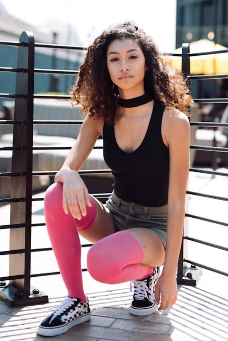Woman wearing pink thigh high socks.