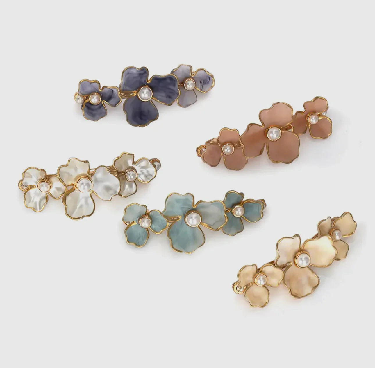 Floral hair clips with pearls in blue, pink, white, gold, and green by Love Classic