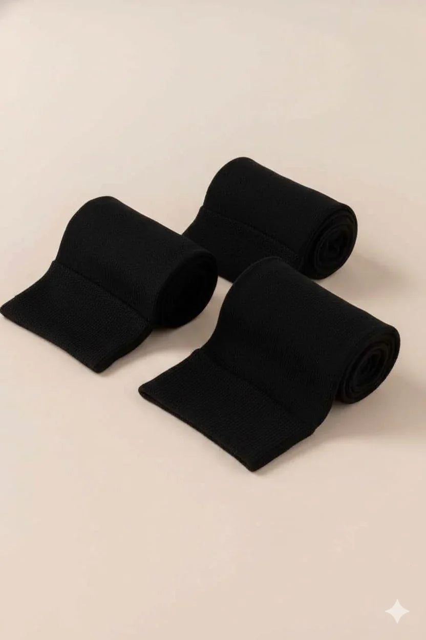 Three black fabric bands neatly rolled on a beige background, Love Classic style