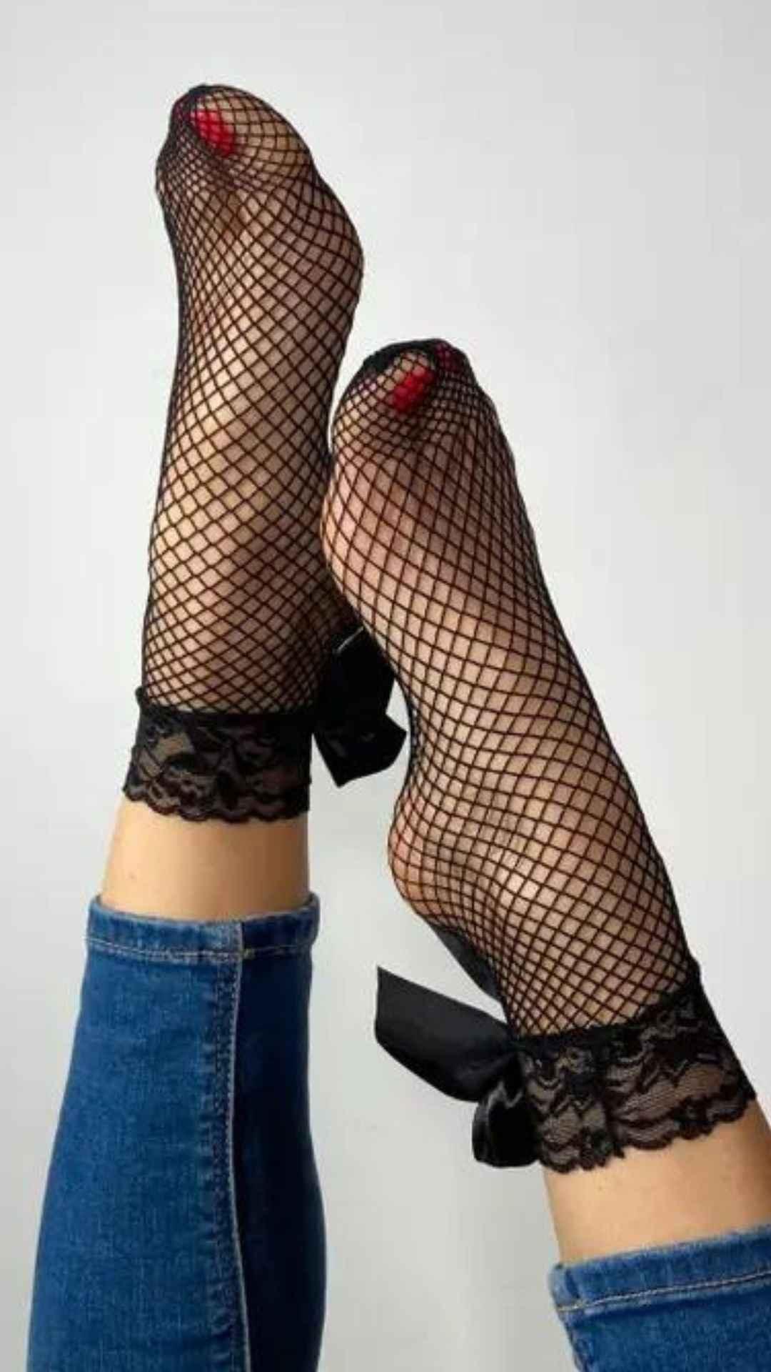 Black fishnet lace socks with bow detail, worn with jeans, Love Classic style fashion