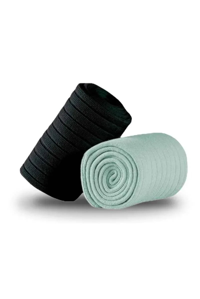 Two rolled elastic bandages, one black and one light mint, on a white background.