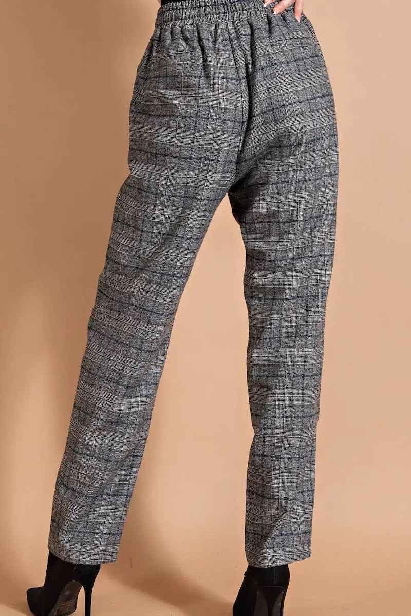 Gray plaid high-waisted pants from Love Classic, styled with black heels on beige background.
