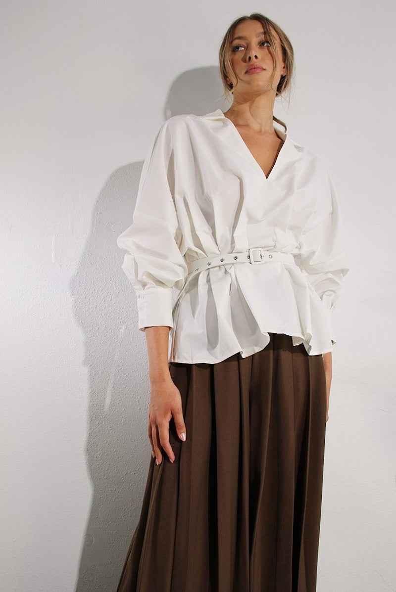Woman wearing a belted white blouse and brown pleated skirt, Love Classic fashion style