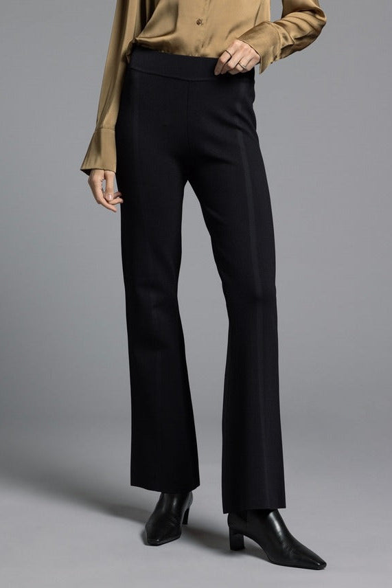 Model wearing black Kick Flare Pants Sasha Pants featuring a retro kick flare silhouette, structured fit through hips and thighs, and subtle ankle flare.