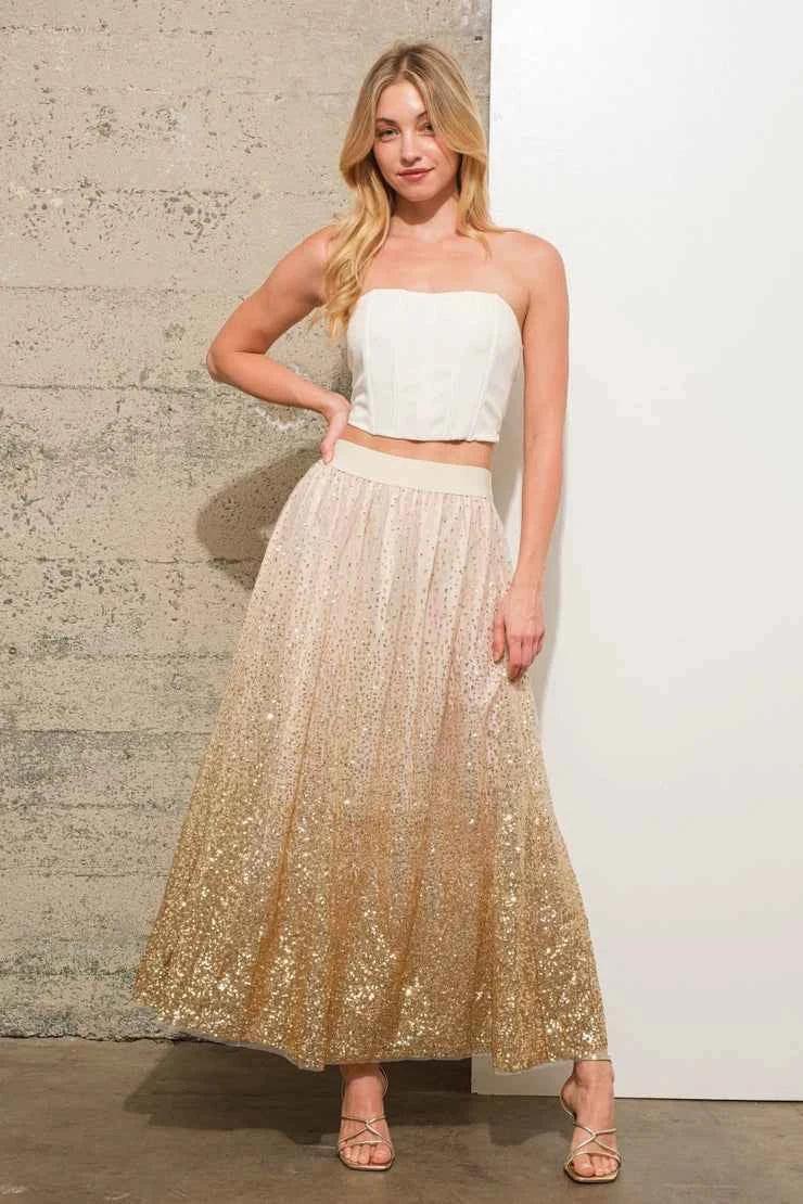 Woman in white strapless top and gold sequin maxi skirt, Love Classic fashion style