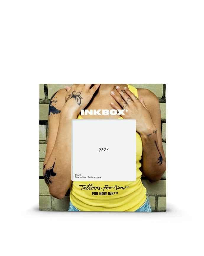 Person in yellow top with temporary tattoo designs on arms, Inkbox packaging, Love Classic style