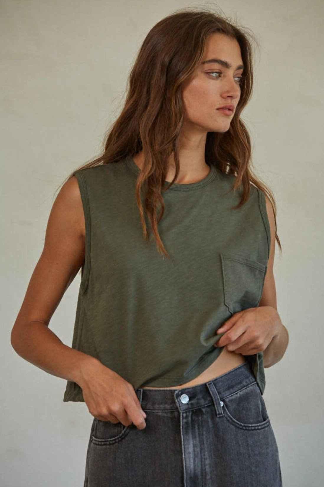 Woman wearing olive green pocket tank top and high-waisted jeans, Love Classic style