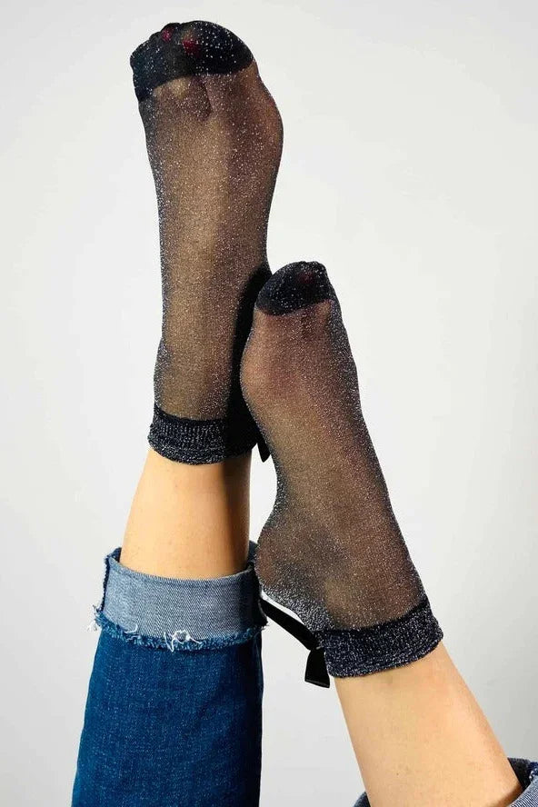 Sheer glitter ankle socks with black trim, worn with rolled-up jeans, Love Classic style