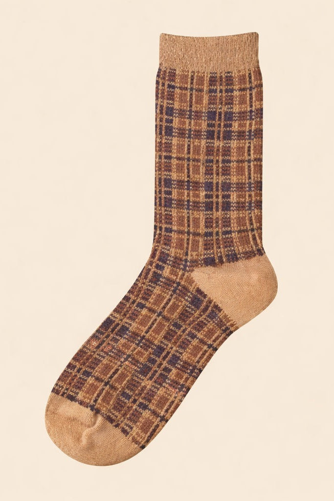 Neutral brown plaid ribbed crew sock with solid heel and toe, photographed on a beige background.