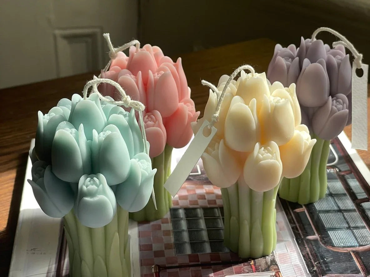 Colorful tulip-shaped candles in pastel shades on a wooden table, Love Classic style